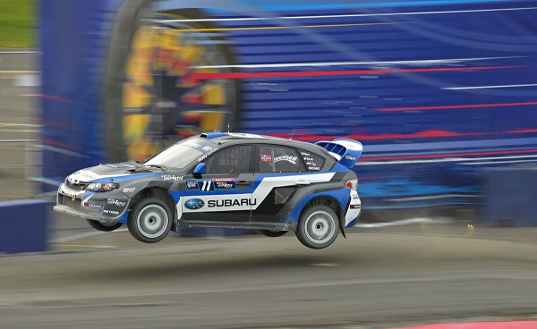 sverre isachsen launches his subaru over the jump at Global Rallycross Washington DC race
