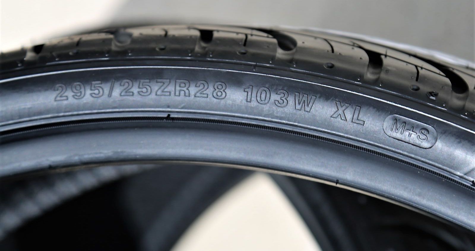 Low profile tire rated for mud and snow