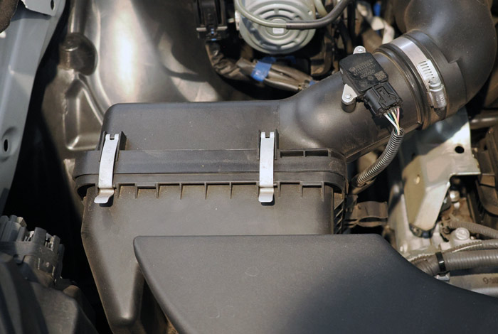 Releasing clips for easy engine air filter replacement