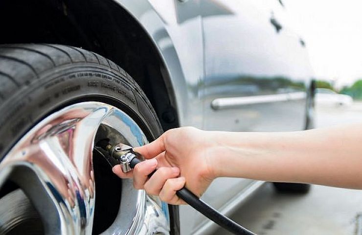 Checking PSI with a tire pressure gauge