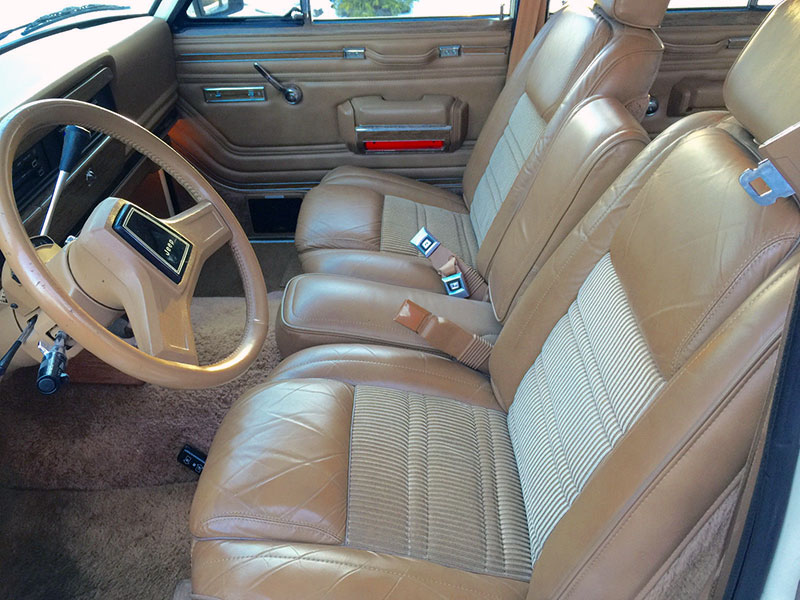 This vintage Jeep Wagoneer's interior is well-preserved.