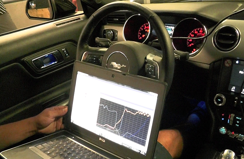 In the middle of the tuning run on the 2017 Ford Mustang. It uses the OBD port.