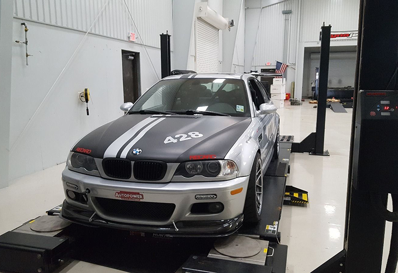 Notice the top of the tire on this BMW race car is closer to the body than the bottom of the tire, indicating that it’s running negative camber for increased traction.