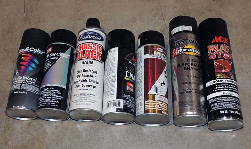 Cans of black spray paint