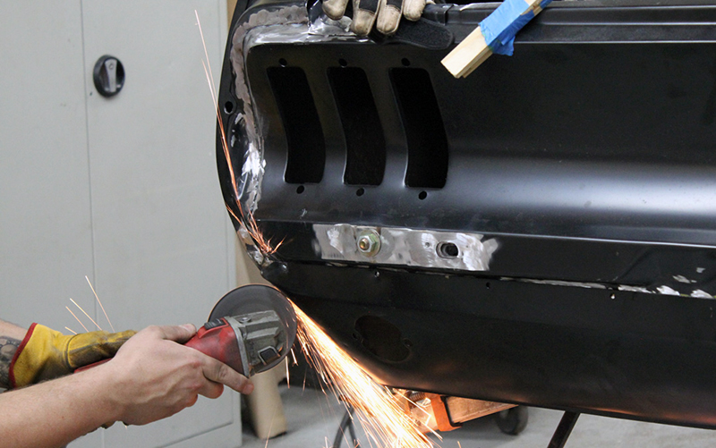 B.J. grinds down the welds on the Mustang’s tail.