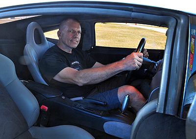 Mike Vetter inside his creation—it’s strictly a two-seater (like the Boxster).