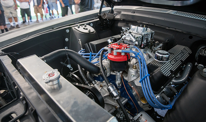 The '67 Fastback's Ford Performance 427 Cobra FE motor is fed via an Edelbrock manifold, topped by a Holly 750 double pumper.