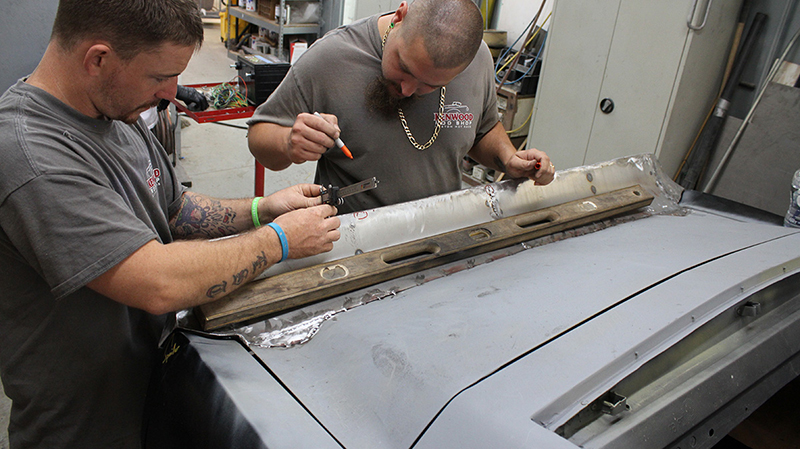 Kenwood Rod Shop’s Jason Eskew (left) and B.J. Thompson (right) fabricate the Mustang’s rear spoiler.