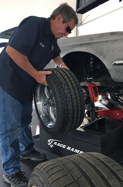 Randy Allgood bolts on an alternate wheel selection.