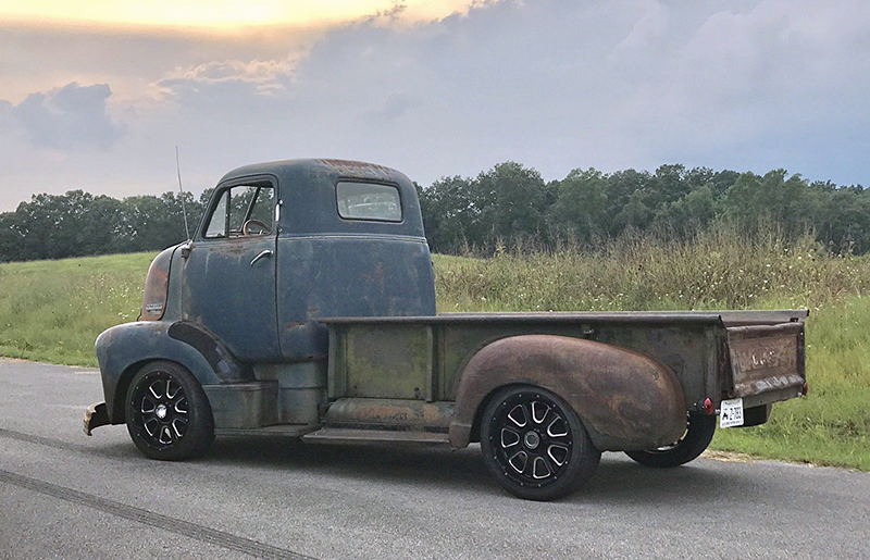 A somewhat traditional 1951 Chevrolet COE serves as a shop truck.