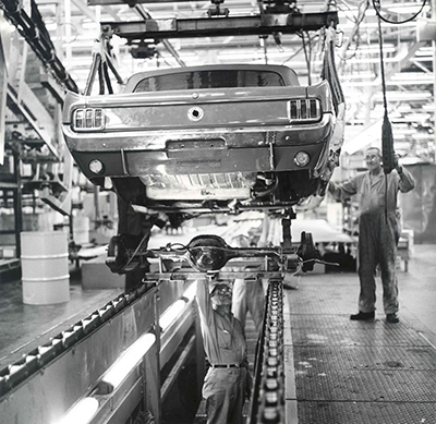 Assembly of the Ford Mustang in 1964, as seen in a photo available on eBay.