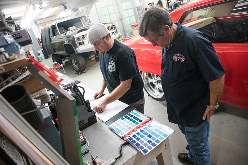 K.C. Mathieu (left) last week stopped by the Kenwood Rod Shop to finalize paint colors with Randy Allgood (right) for the eBay Motors Mustang Fastback.