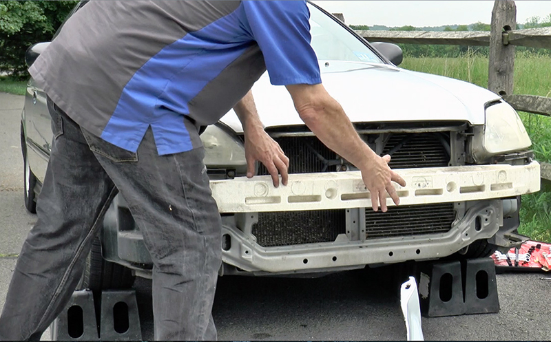 The Civic's bumper foam is held in place by friction. No adhesives are necessary.