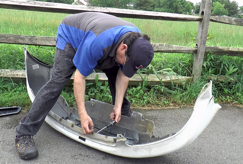Directly swapping the fasteners from the old to the new bumper helps avoid misplacing any of the pieces.