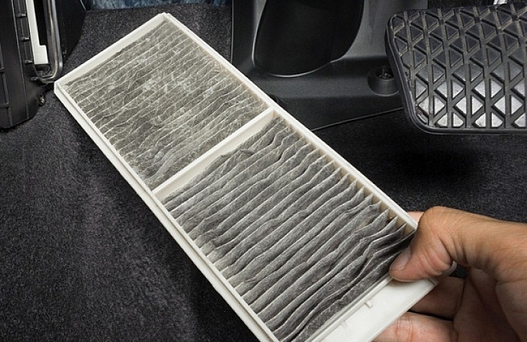 Car cabin air filter accessed from under the dashboard.