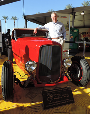 Bruce Meyer poses with the McGee Roadster