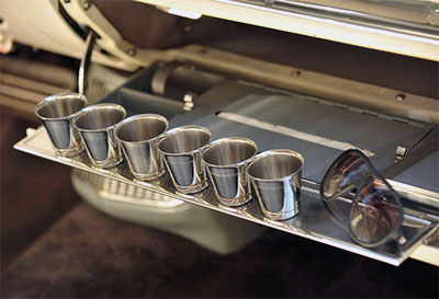 The 1958 Eldorado Brougham’s glove box took the idea to the extreme by featuring a complete set of stainless-steel shot glasses.