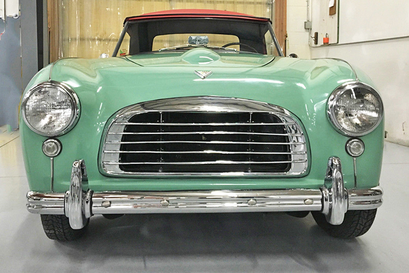 The front of the car mixes Austin-Healey and Ferrari influences.