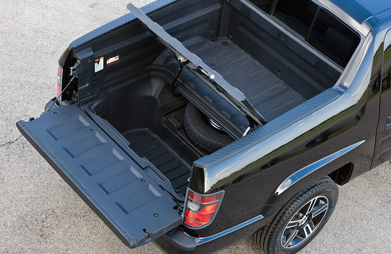 Honda Ridgeline offers a secure recessed storage in the floor of the cargo bed.