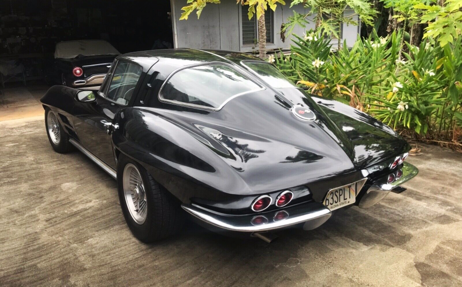 Rear exterior view of a 1963 Chevy Corvette, an example of the second generation of Corvettes.