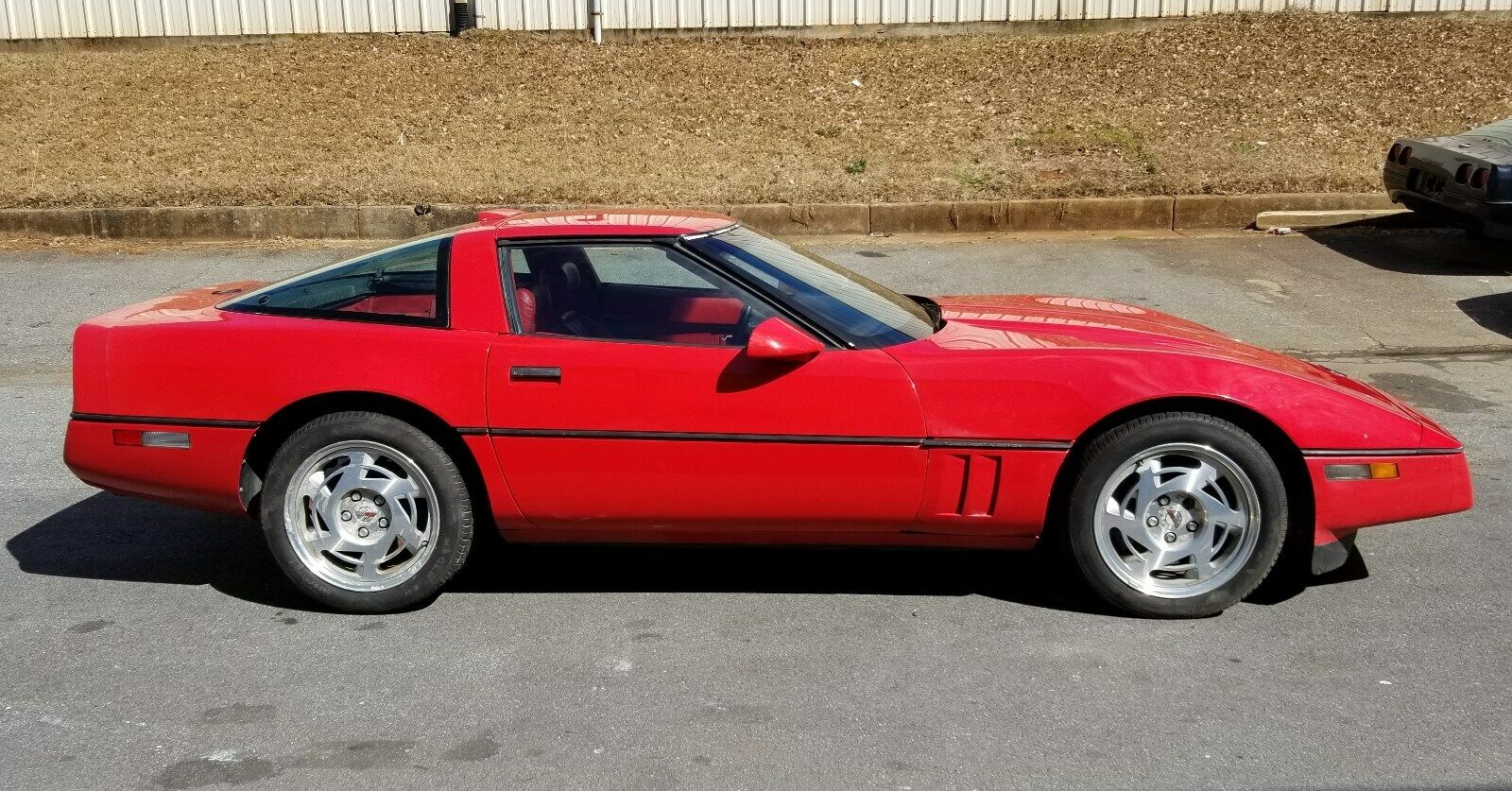 Exterior passenger-side view of a 1984 Chevrolet Corvette, an example of a fourth-generation Corvette.