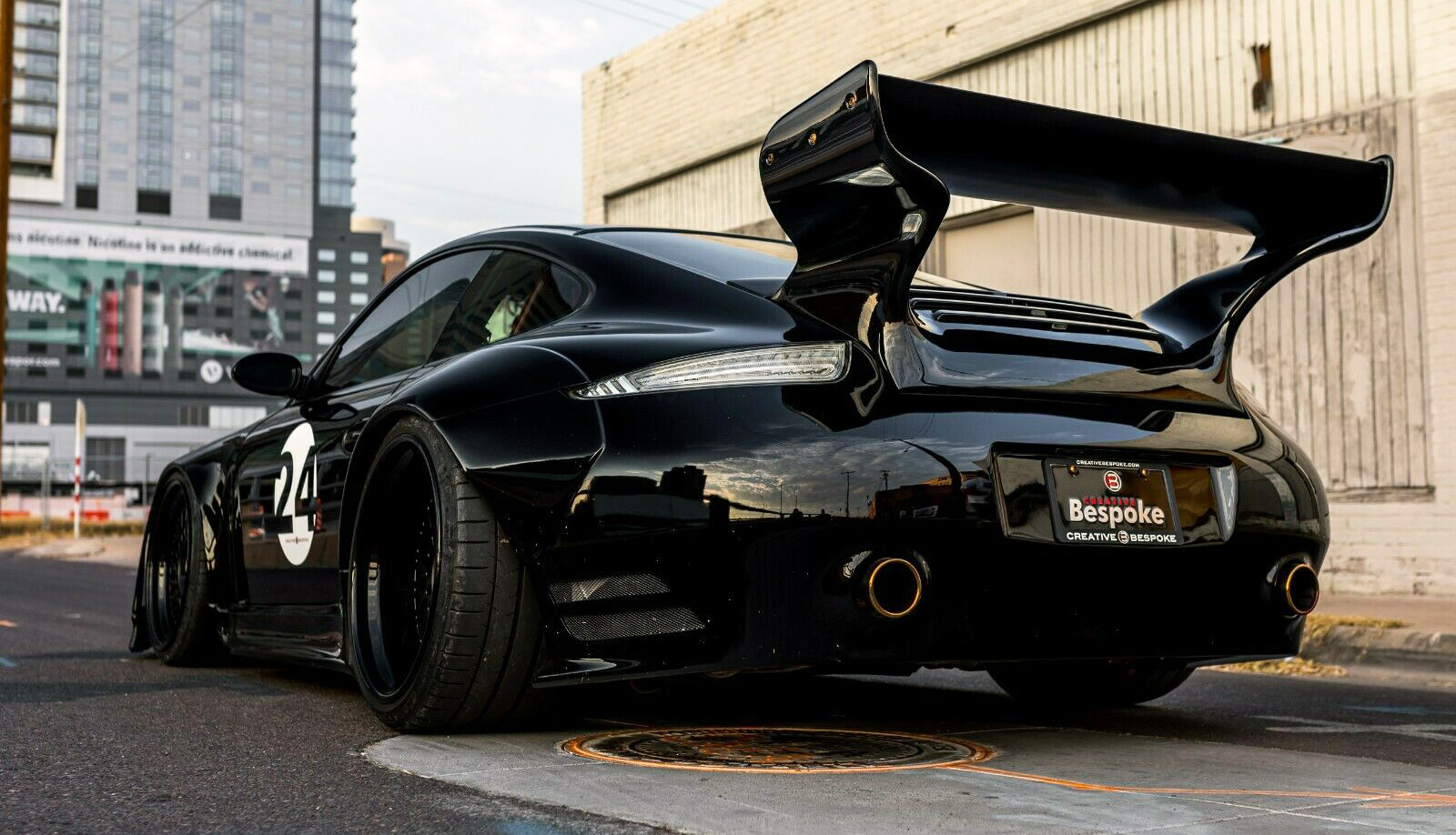 This highly modified 2007 Porsche 911 has bulging wheel wheels to make room for sporty Pirelli tires.