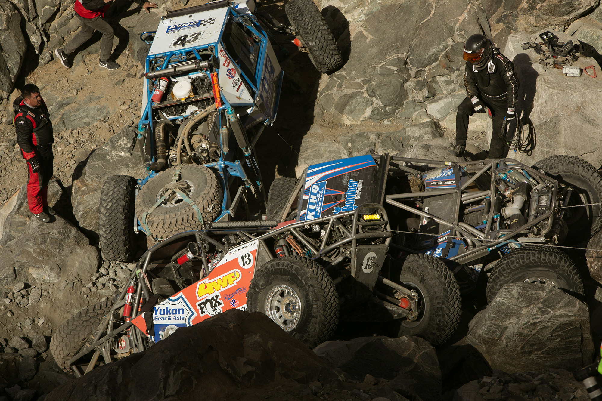 Race traffic is no joke. The leader, Gomez #83, couldn't pass while #13 was also winched off the boulder.