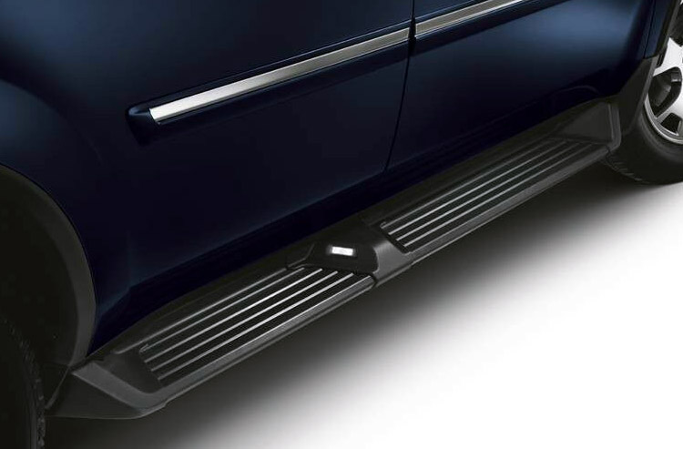 Lights on a running board help passengers safely enter a car at night.
