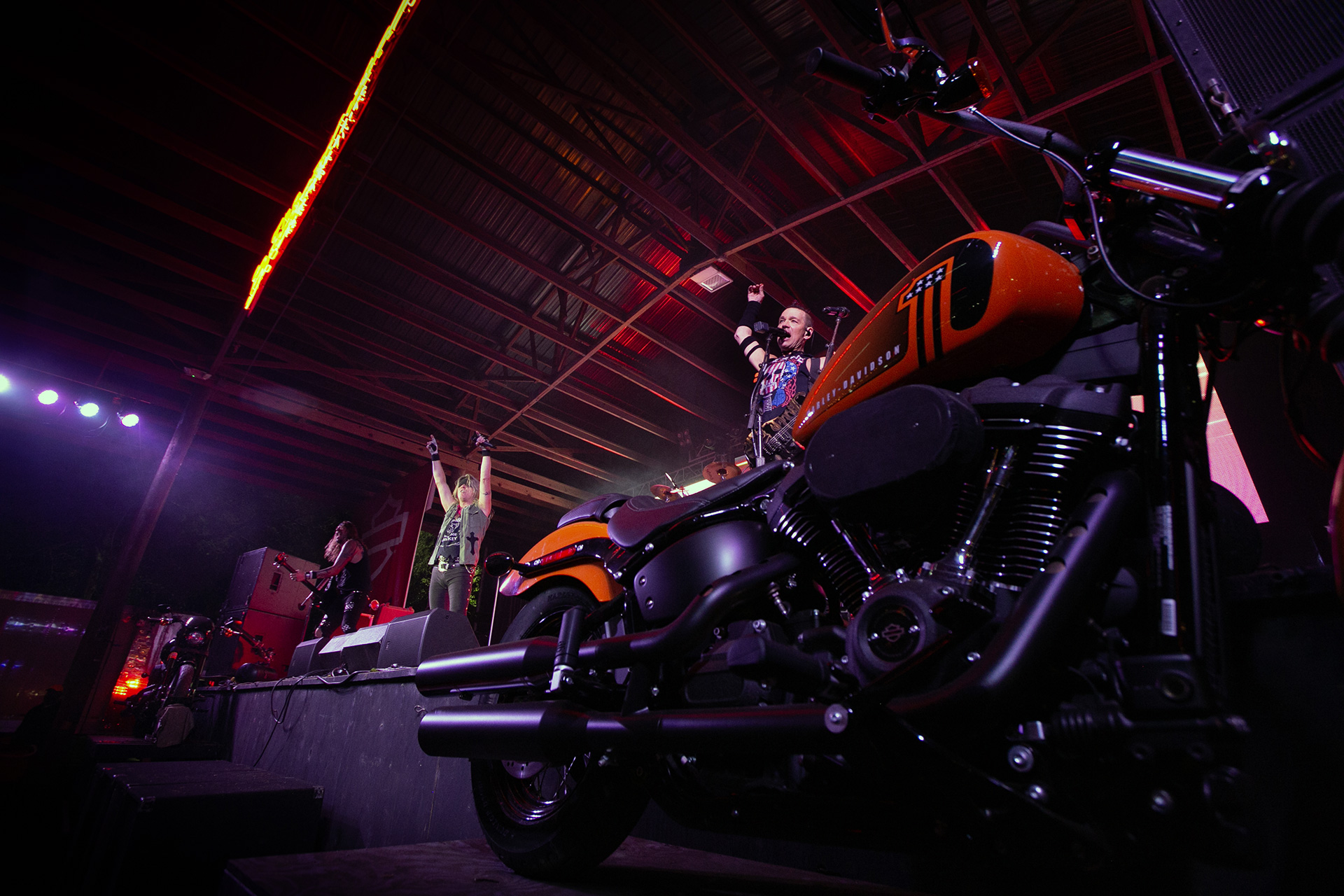 Hairball plays at the Broken Spoke Saloon, with two Harley-Davidsons flanking the stage