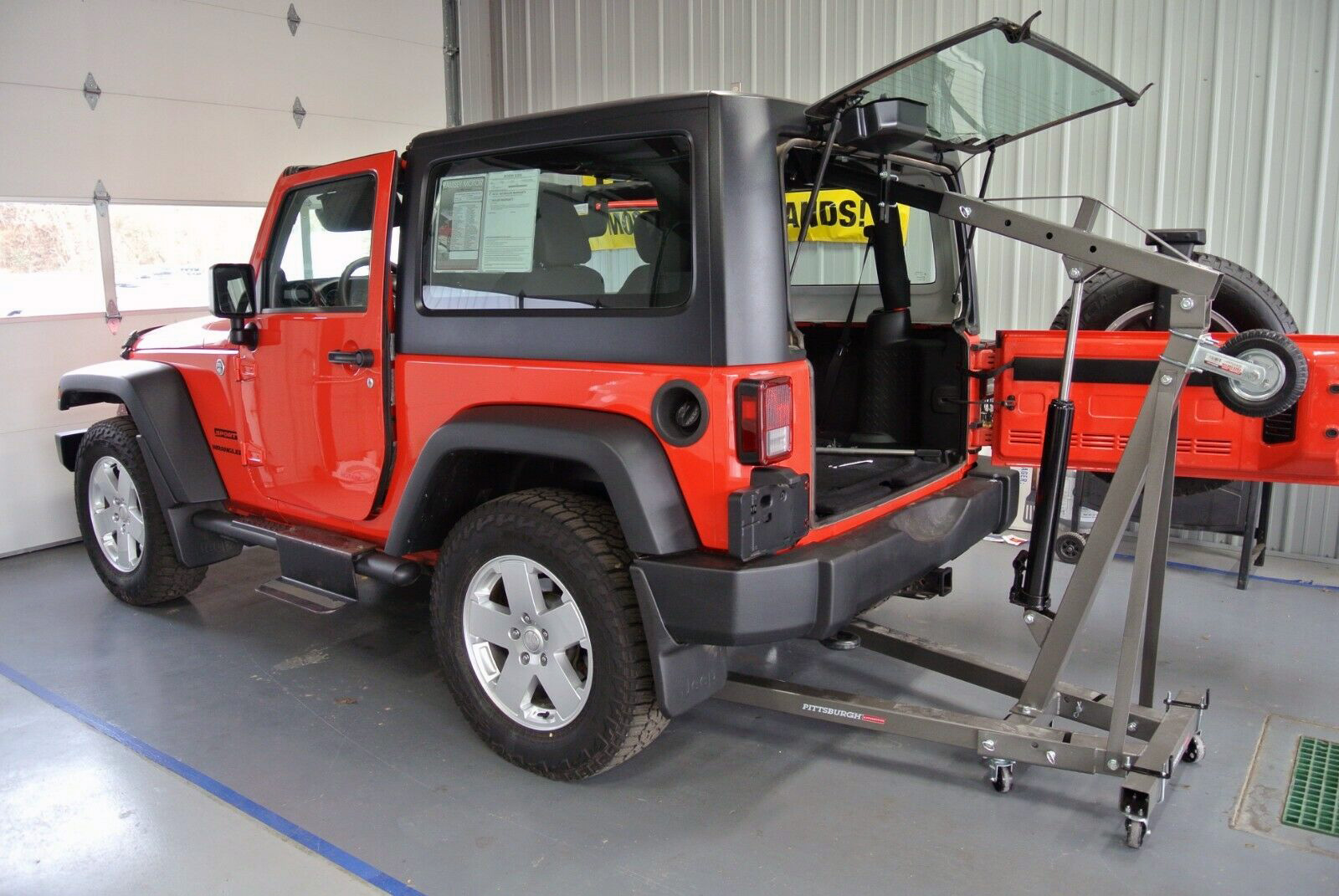 A hoist offers a safe and convenient way to remove and store a Jeep hardtop.