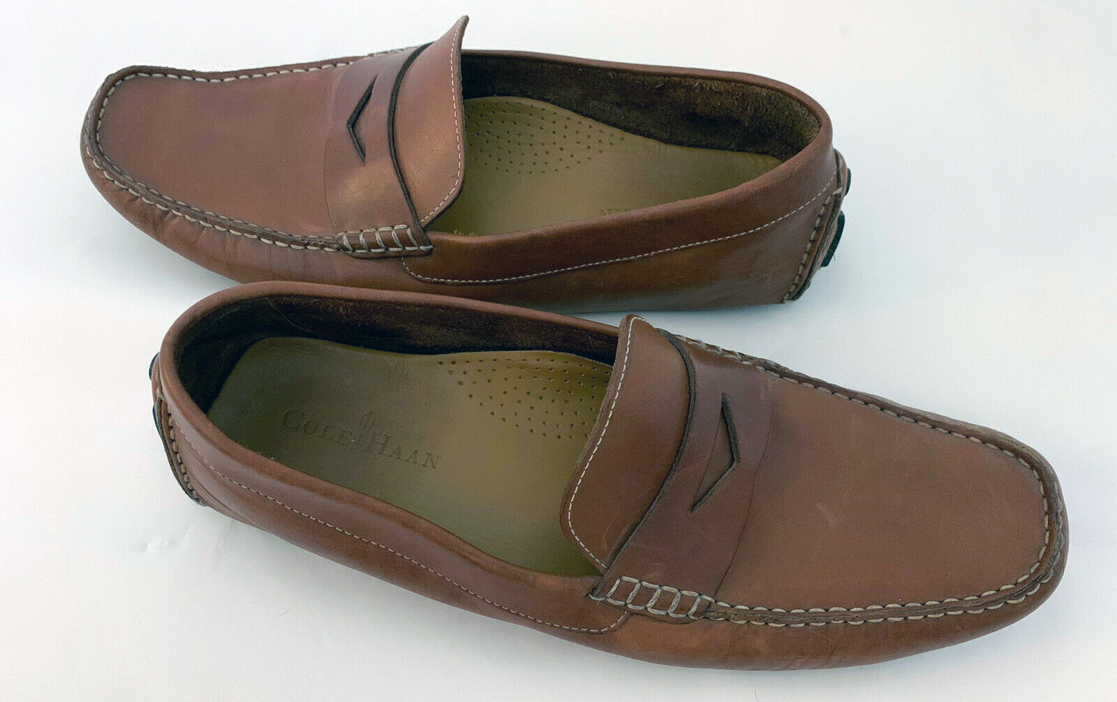 These tan leather Cole Haan size 12 M driving loafers were offered pre-owned for $40.
