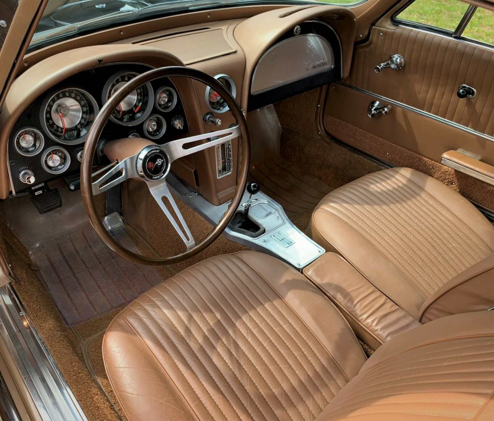 The saddle tan leather interior matches the Corvette's exterior paint.