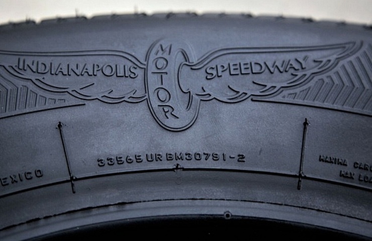 Company branding and size specs on the side of the tire