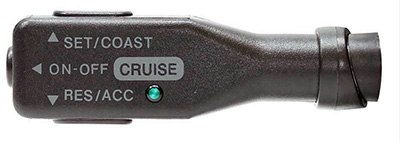 A dash-mounted controller activates cruise control.