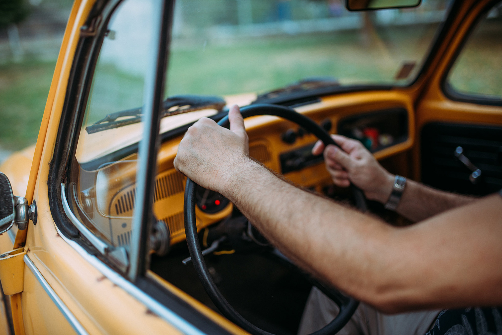 Hands on a steering wheel