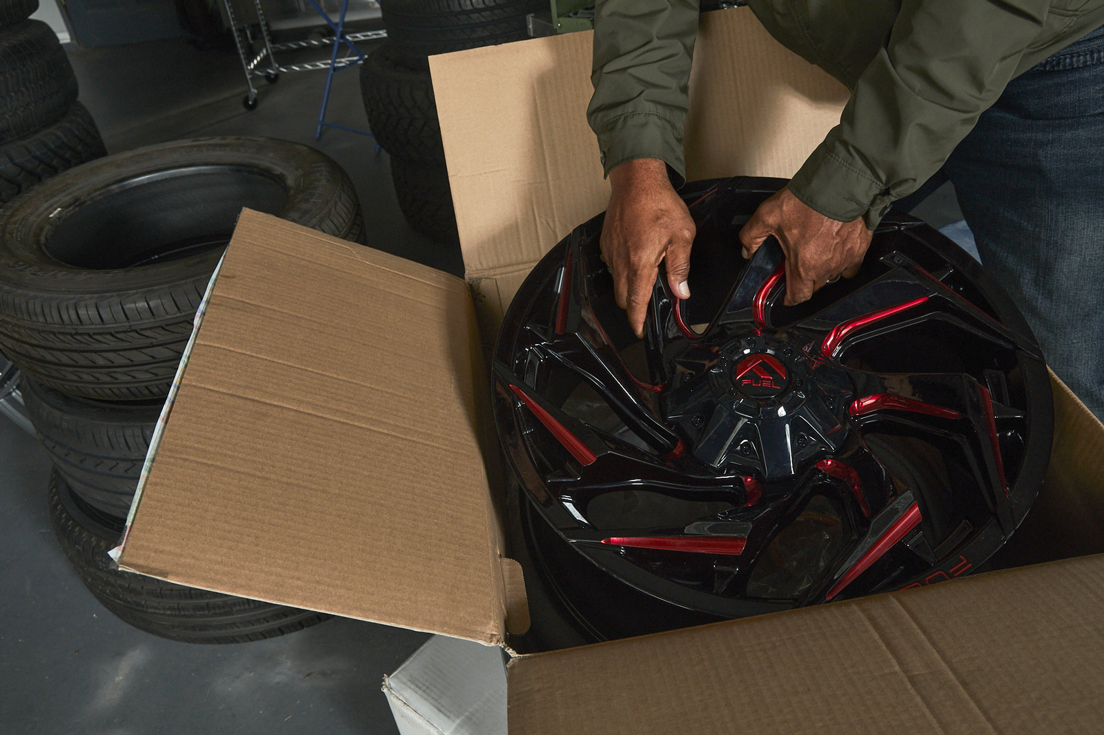A red and black tire rim