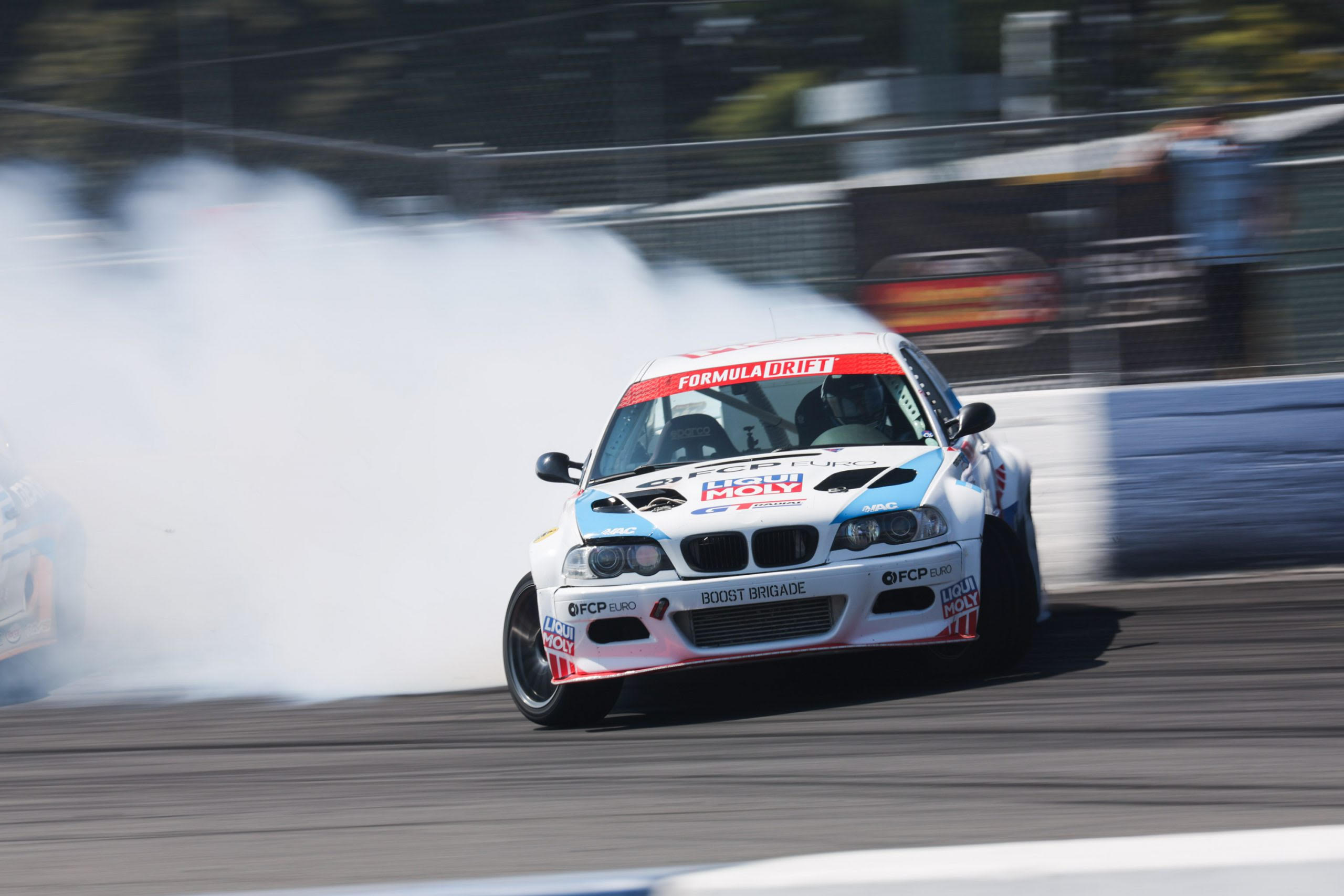 2013 Formula Drift Champion Michael Essa drifting on a racetrack