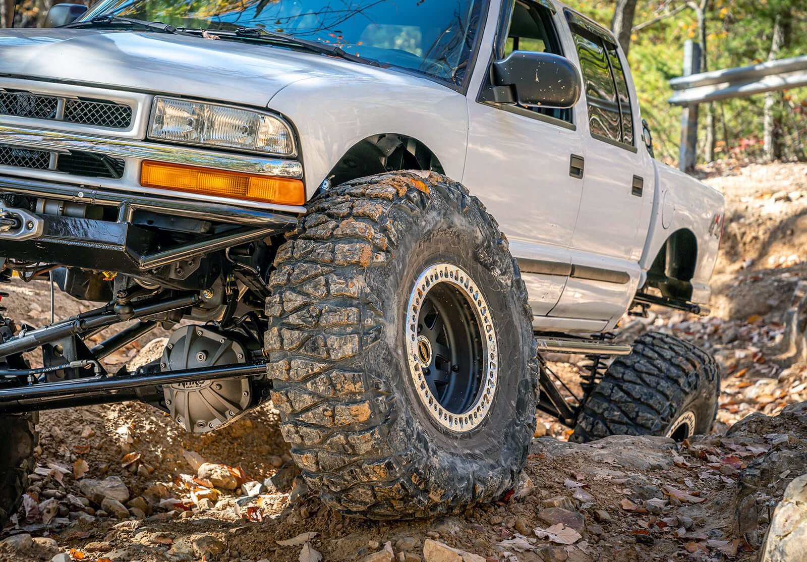 The aggressive tread of a mud terrain tire.