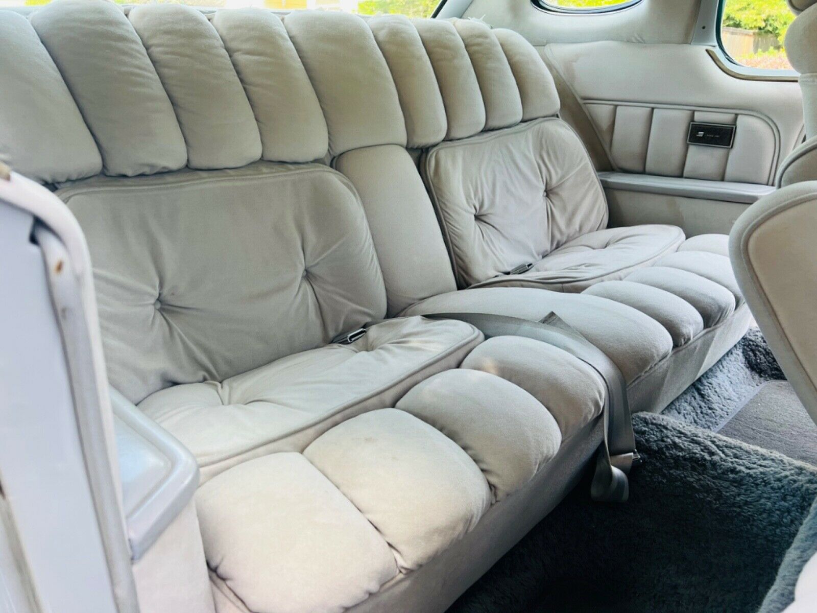 The grey velour interior of the 1976 Lincoln Continental Cartier Edition for sale on eBay.