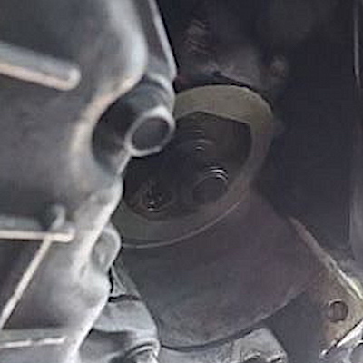 Twist the fresh oil filter onto the threads carefully. It should be finger-tight.
