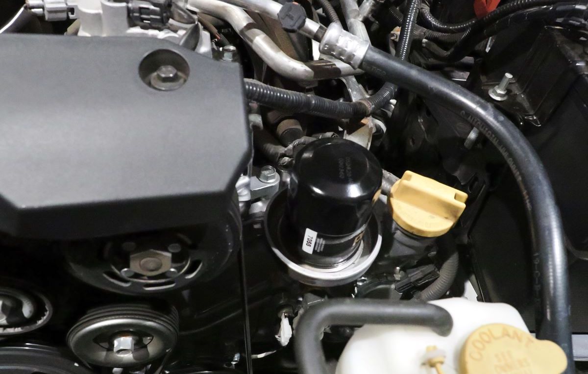 Top mount oil filter.