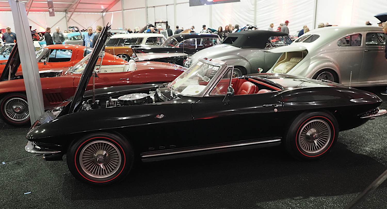 black and red second-generation Chevrolet Corvette convertible at Barrett-Jackson