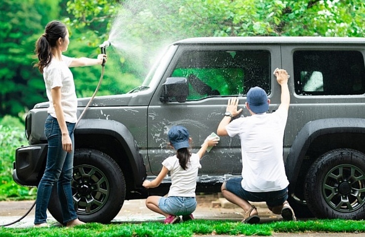 Springtime car prep - family washing SUV