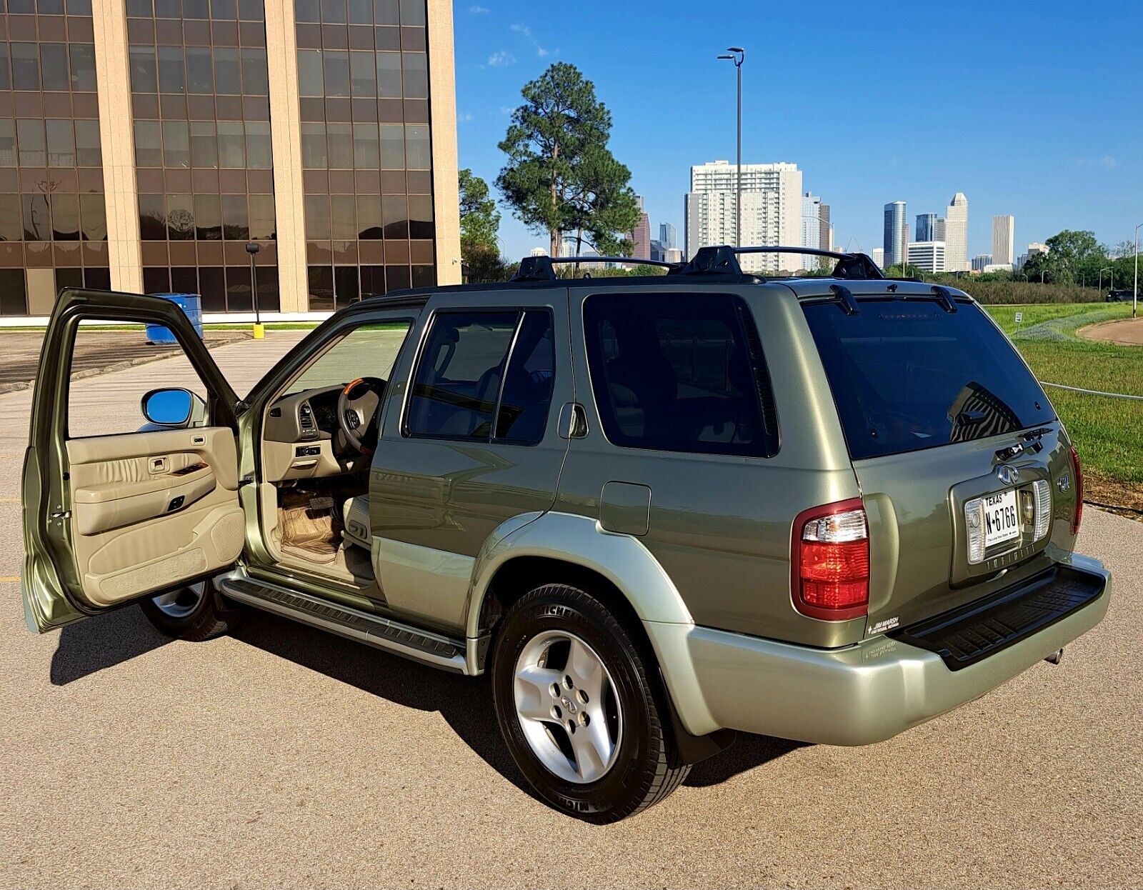 2003 Infiniti QX4 - left rear profile - driver's door open