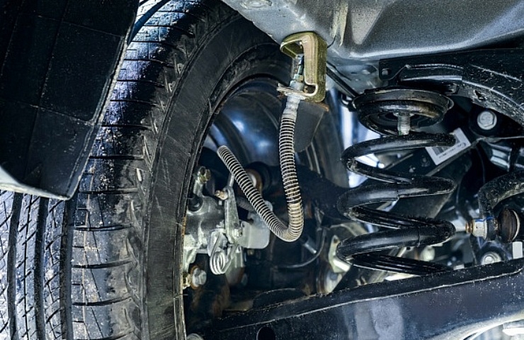 Suspension of a new car showing the brake hose