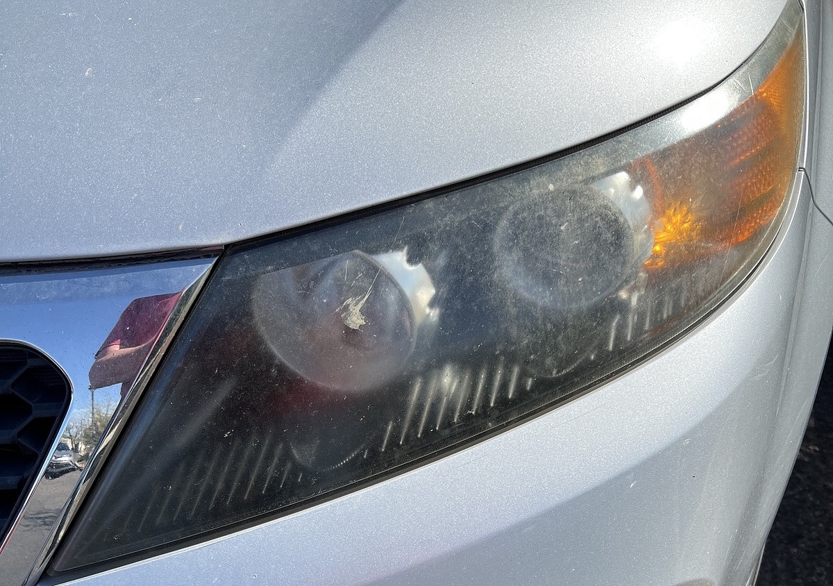 headlight lens hacks - fogged headlamp on silver car