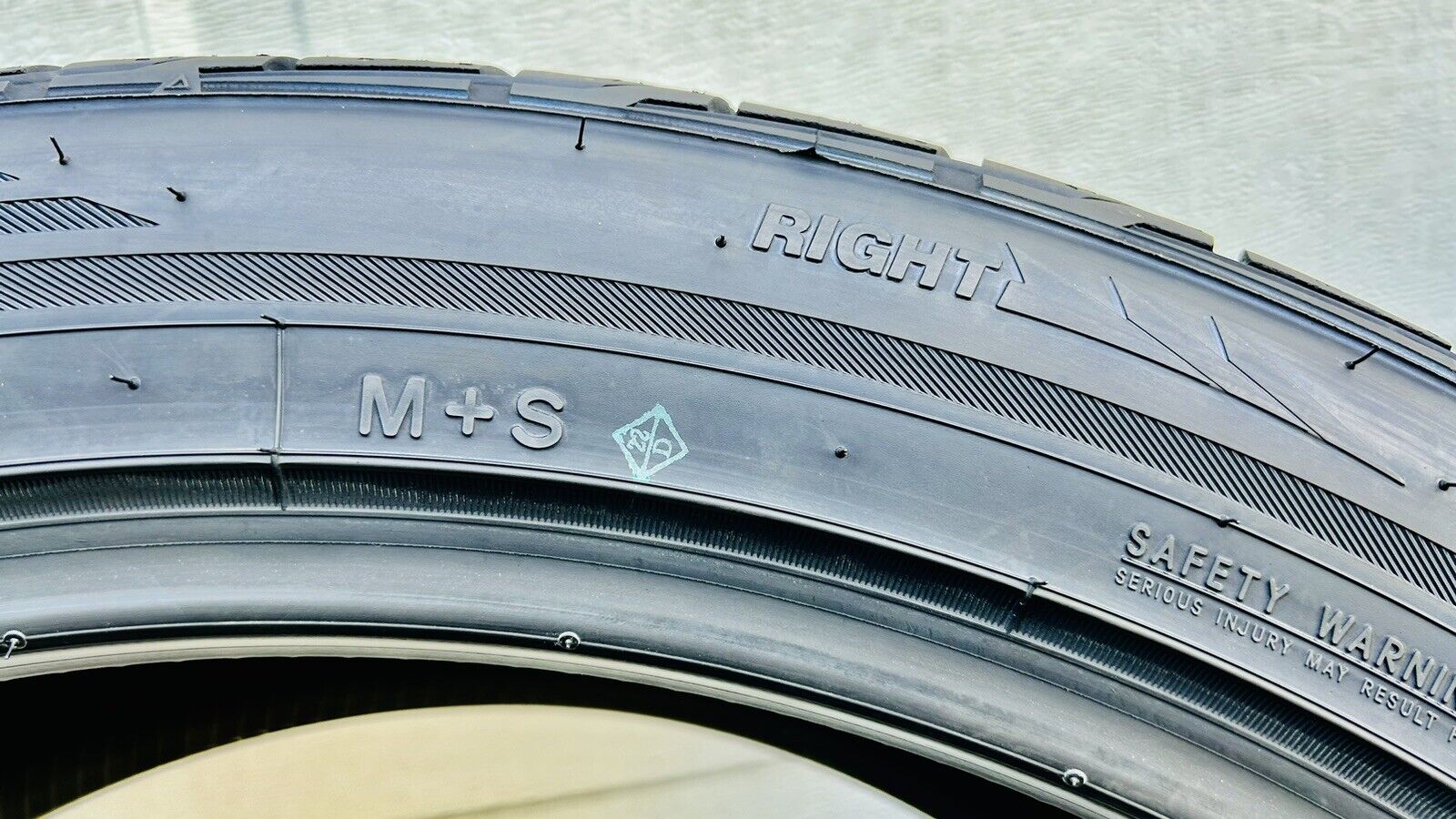 The Toyo Proxes ST III's sidewall indicates the directional tire's mounting direction.