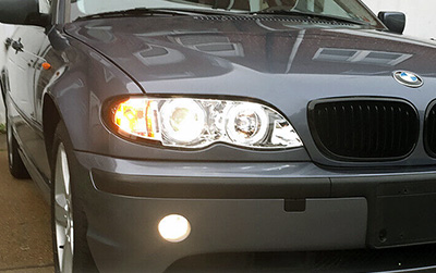 A BMW with projector headlights
