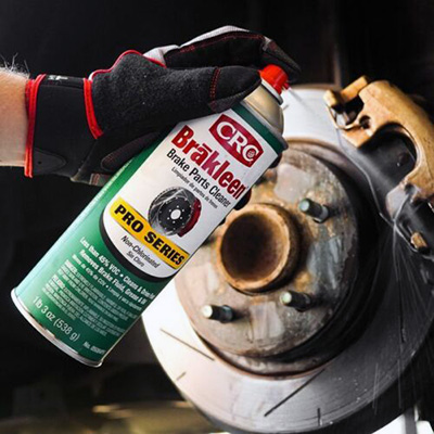 Spraying Brakleen brake cleaner