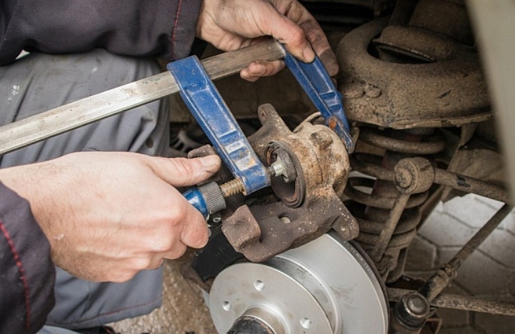 Compressing a brake caliper